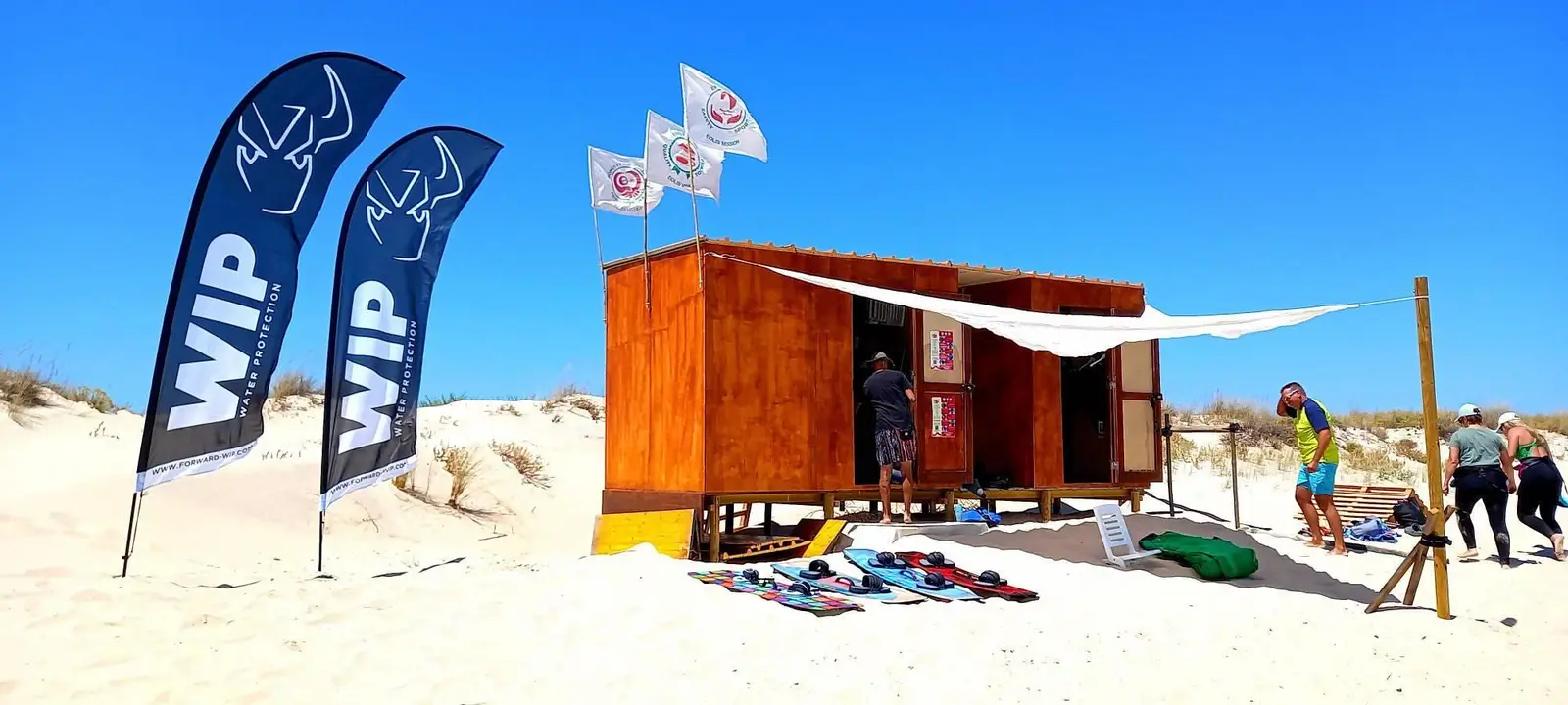 The Eolis beach cabin with flags and gear