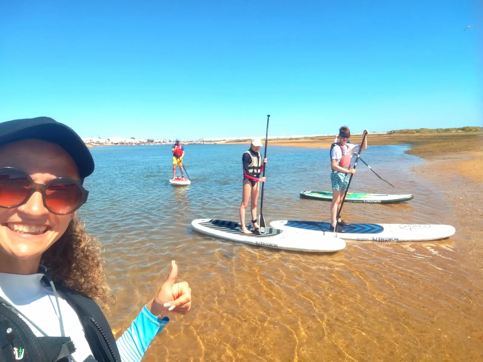 Group on a paddleboard tour in the Ria Formosa with the guide